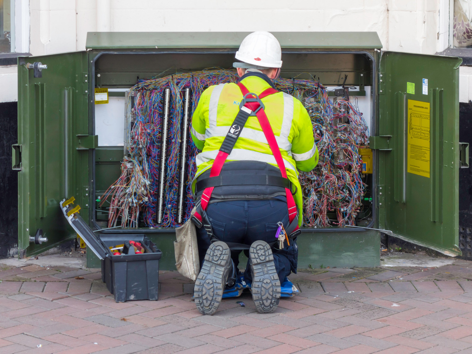 telecoms cis worker in a bt cabinet